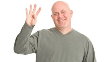 why do guys hold up 4 fingers in pictures